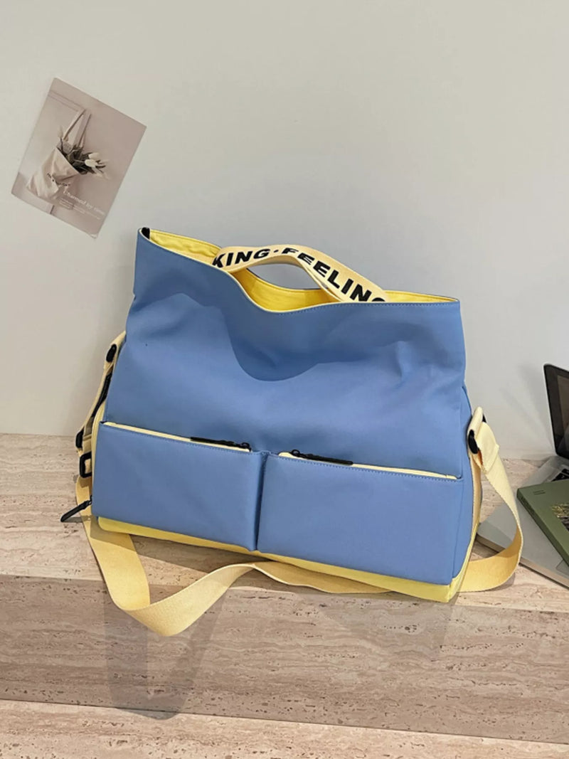 Blue bag with yellow straps on a wooden surface