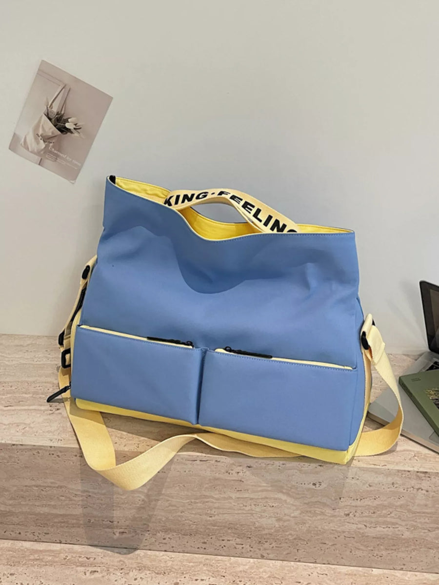 Blue bag with yellow straps on a wooden surface