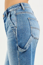 Close-up of blue jeans on a white background