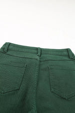 Green pants with back pocket detail on a white background