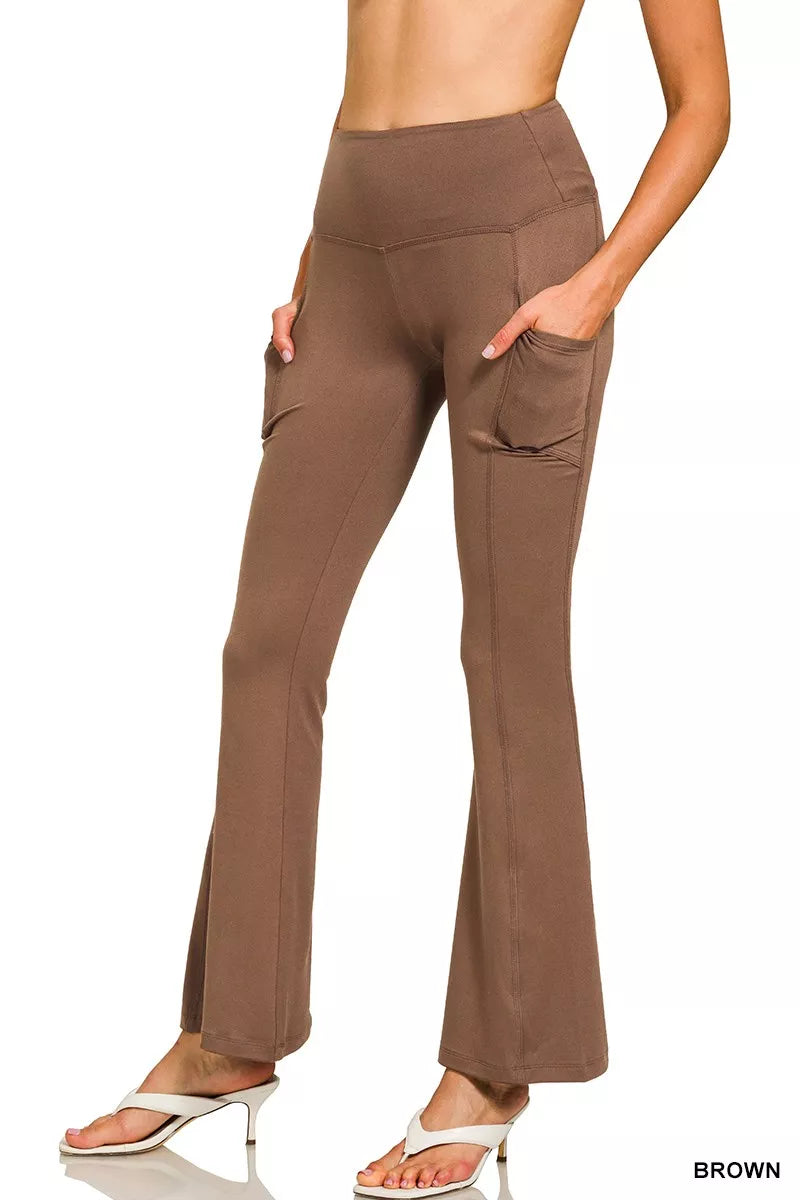 Brown pants worn by a person on a white background