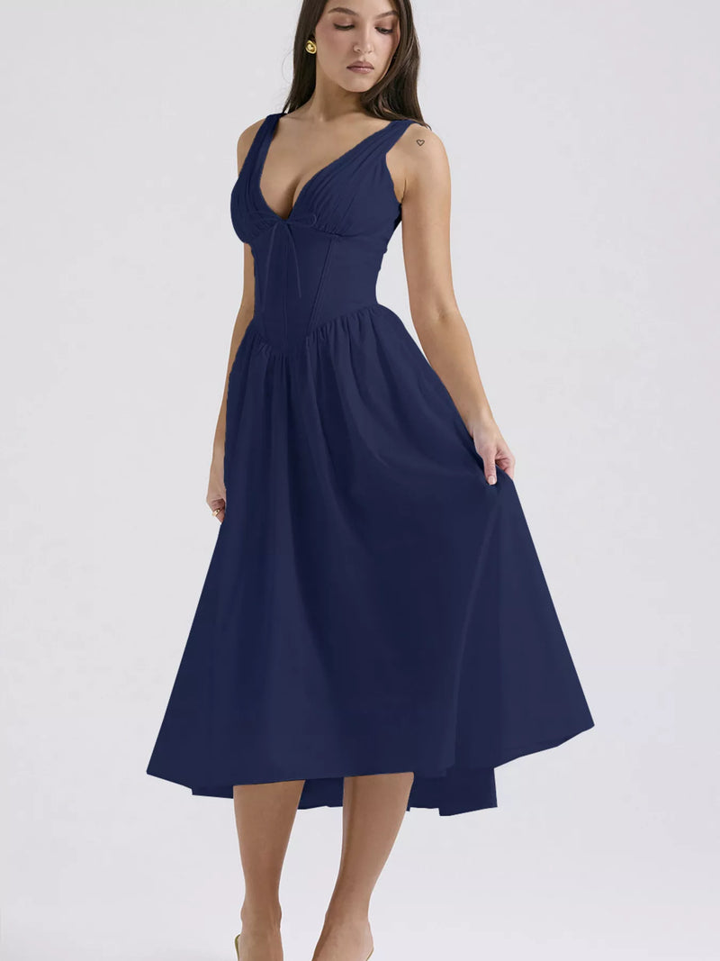 Navy blue dress worn by a model on a light gray background