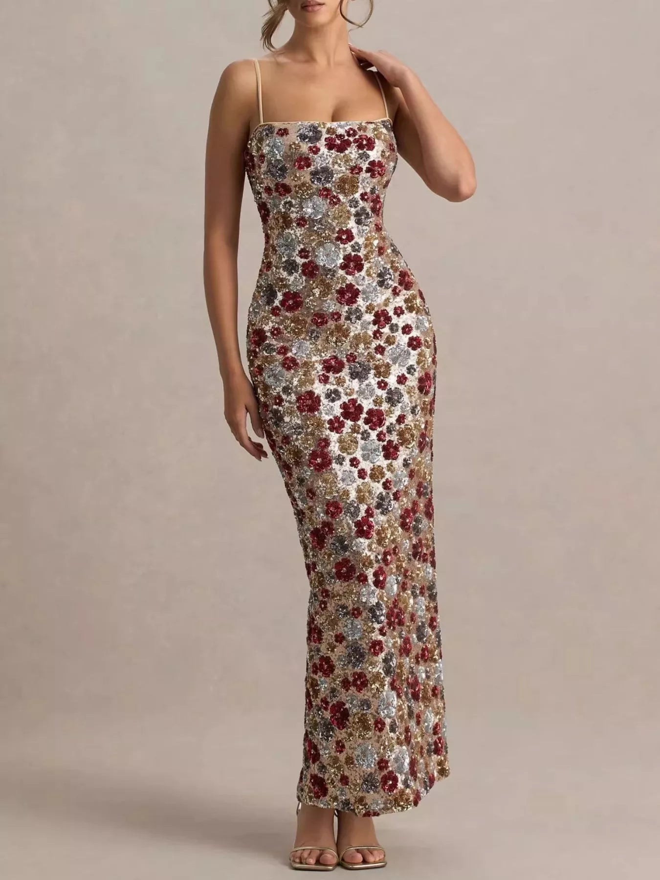 Woman wearing a floral dress against a beige background