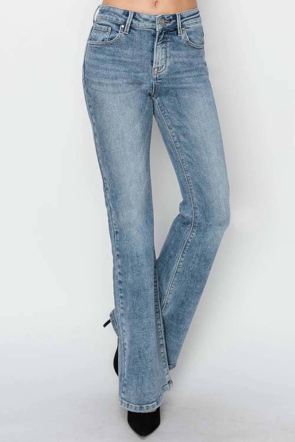 Light blue jeans worn by a person on a white background
