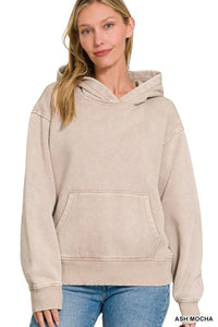 Woman wearing an ash mocha hoodie on a white background