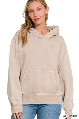 Woman wearing an ash mocha hoodie on a white background