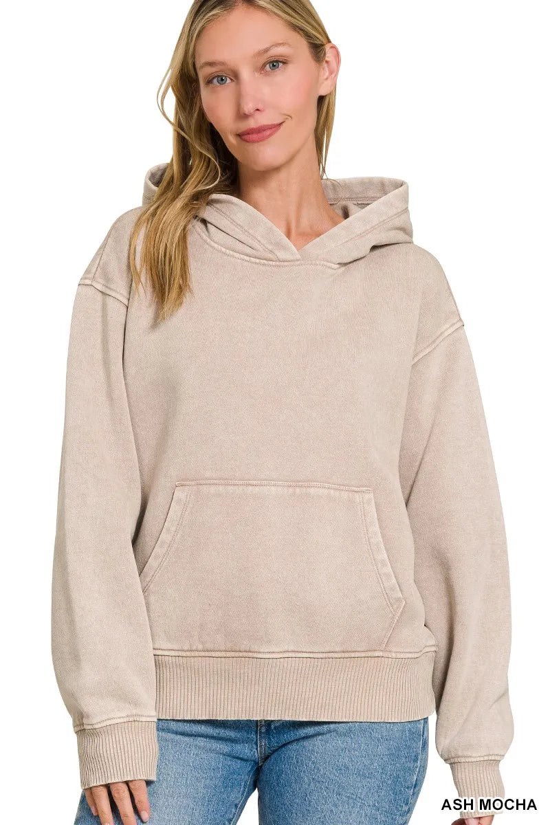 Woman wearing an ash mocha hoodie on a white background