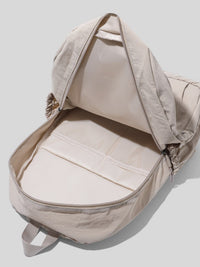 Beige backpack with a hood on a light gray background