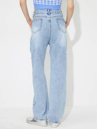 Light blue jeans worn by a person on a white background