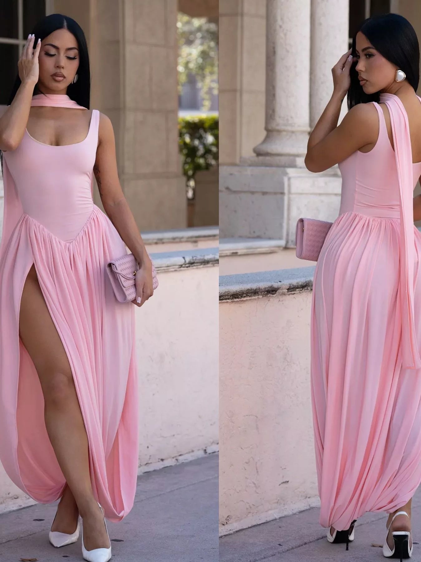 Woman in a pink dress with a high slit standing outdoors.