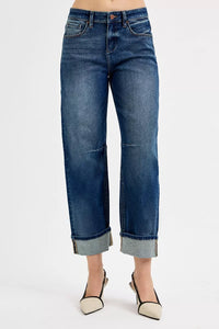 Blue jeans worn by a person on a white background