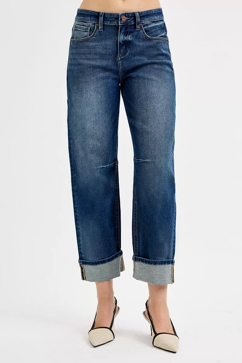 Blue jeans worn by a person on a white background