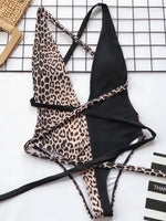 Leopard print and black bikini set on a white background