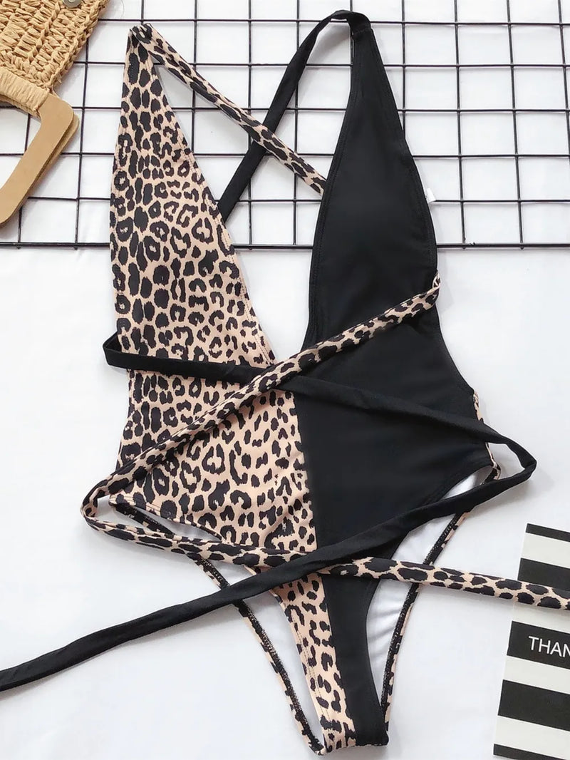 Leopard print and black bikini set on a white background