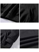 Four-panel close-up collage of a black garment, showing fabric texture, ribbed cuffs, a pocket opening, and folded material details.