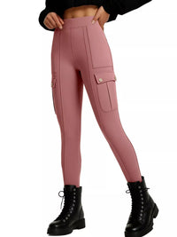 Pink cargo leggings worn with black boots on a white background