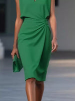 Green dress worn by a model with a blurred background