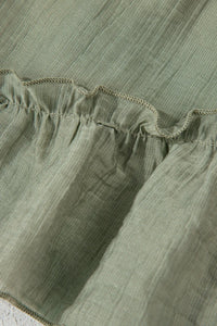 Close-up of green fabric with ruffled edge