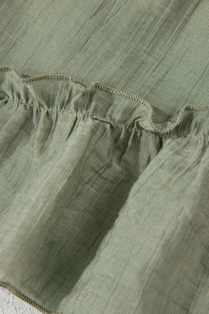 Close-up of green fabric with ruffled edge