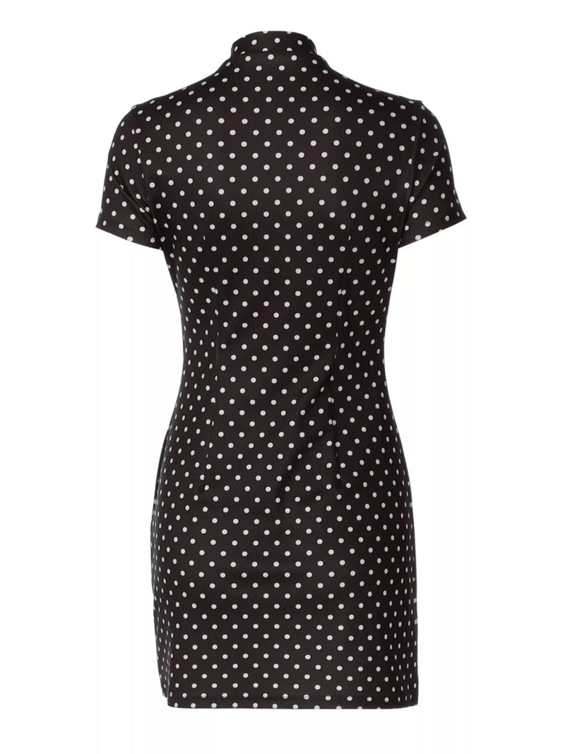 Black dress with white polka dot pattern on a white background