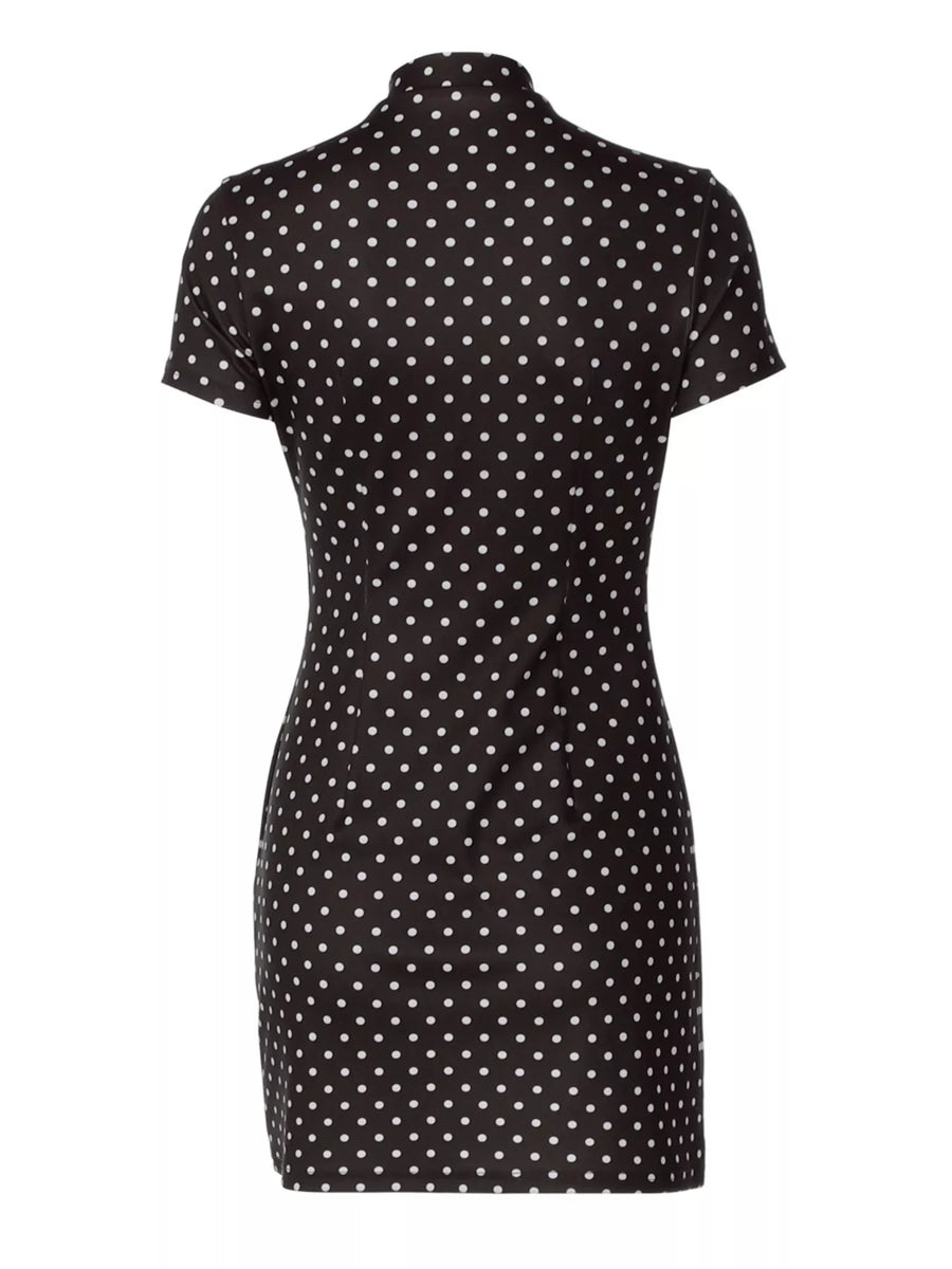Black dress with white polka dot pattern on a white background