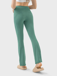 Green leggings worn by a person on a light gray background