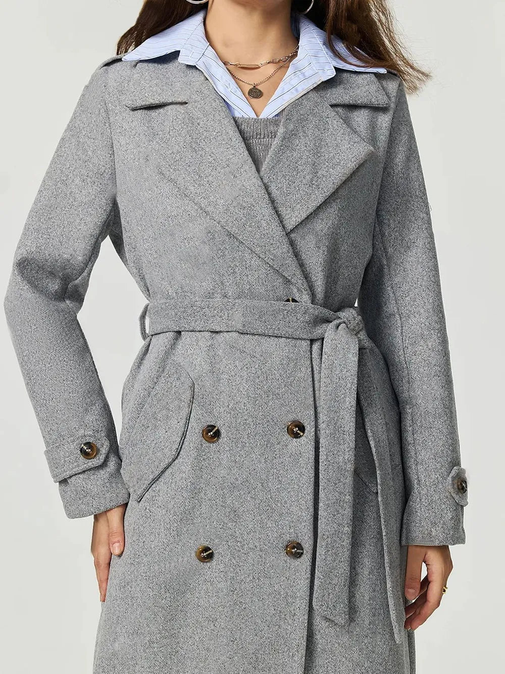 Gray coat with a belt on a white background