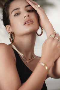 Woman showing her 1.5" Ryan Hoops