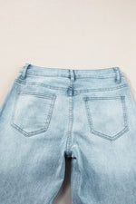 Light blue jeans on a beige background