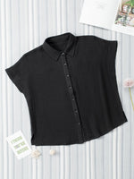 Black sleeveless blouse on a white background