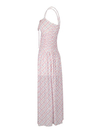Pink patterned dress on a white background