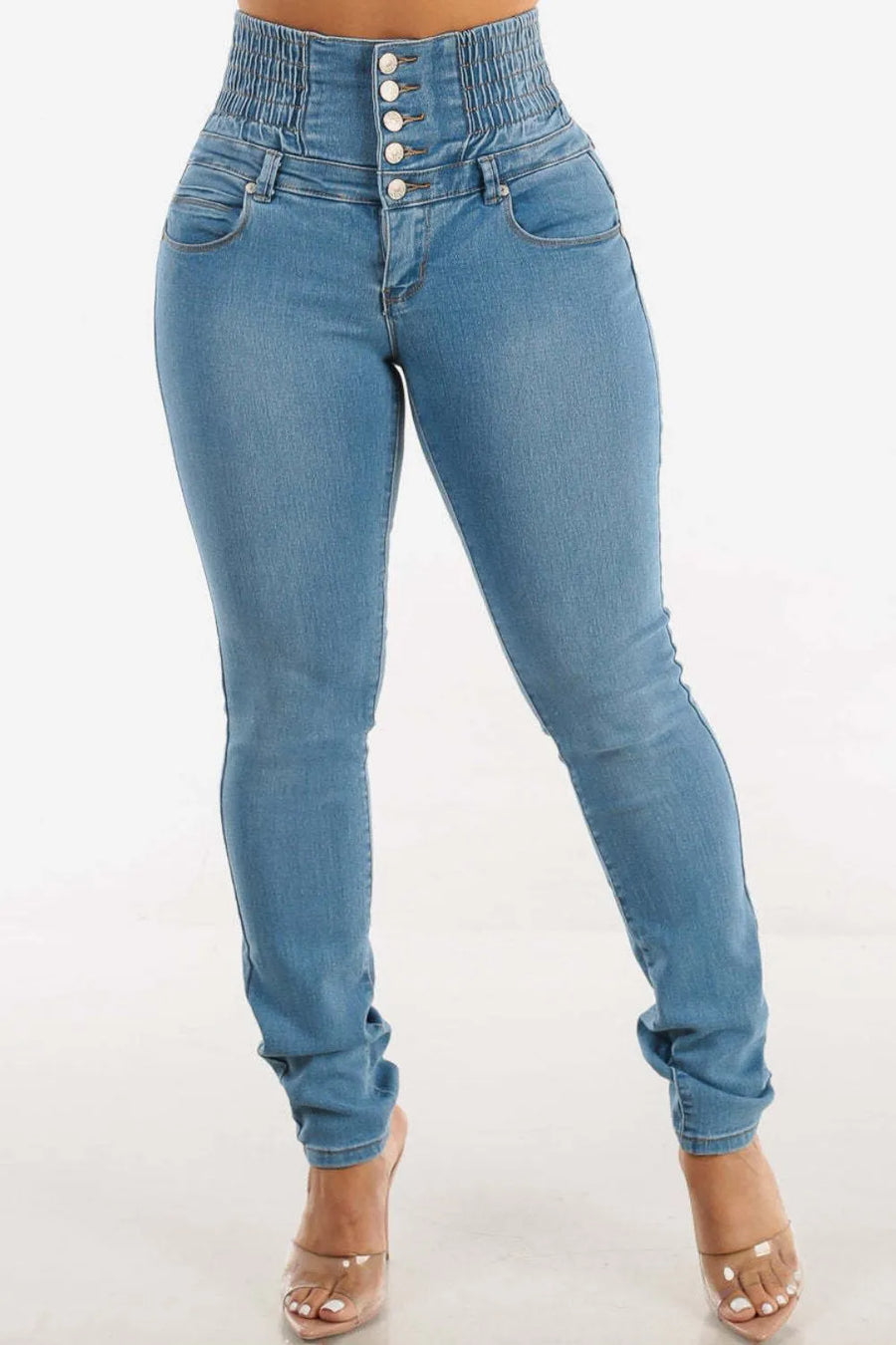 Blue jeans with button fly on a white background