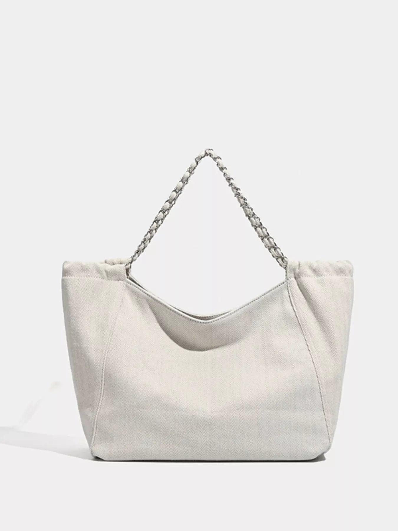 Light gray handbag with a chain detail on a light gray background
