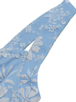 Blue lace fabric with floral patterns on a white background