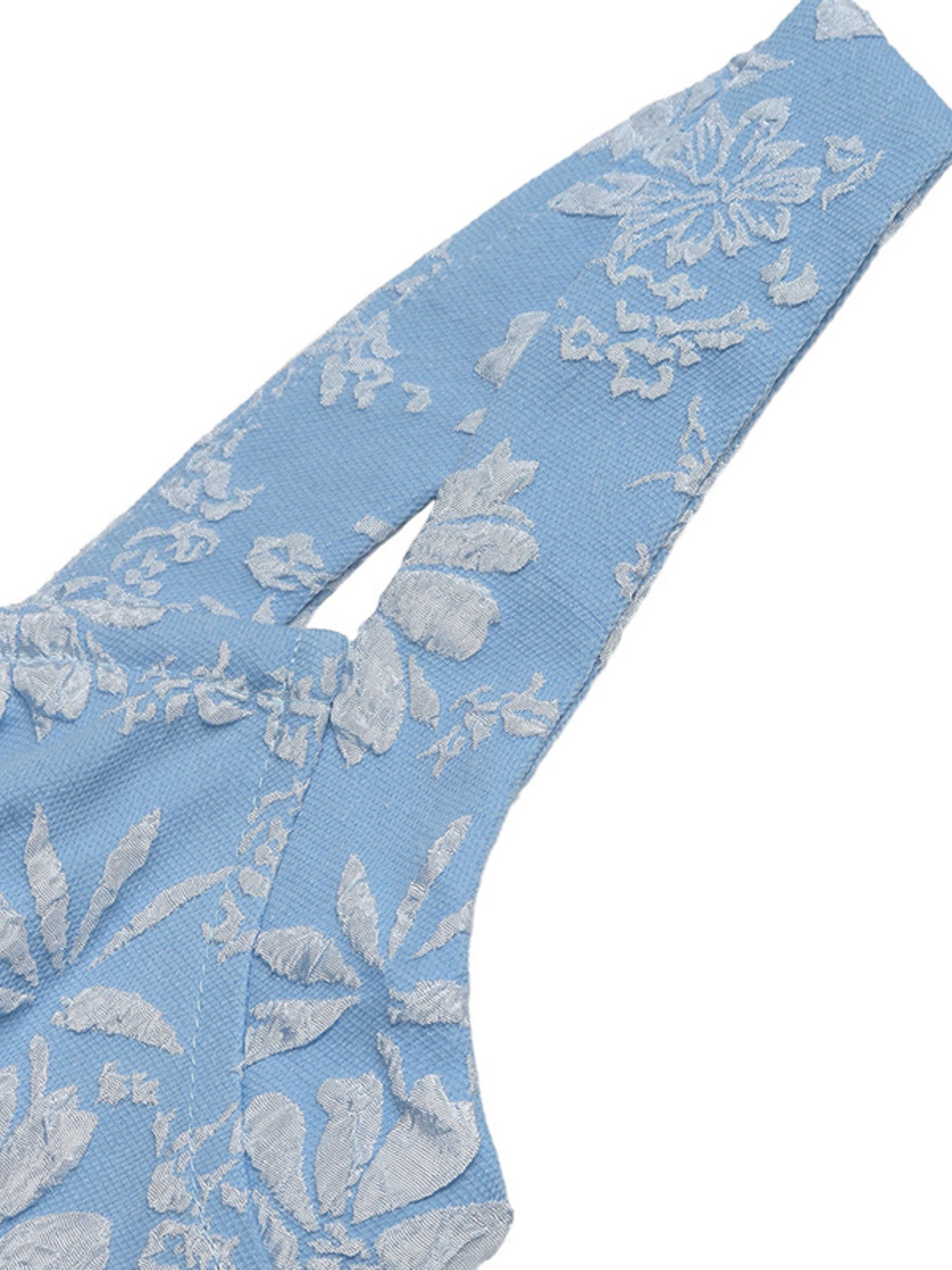 Blue lace fabric with floral patterns on a white background