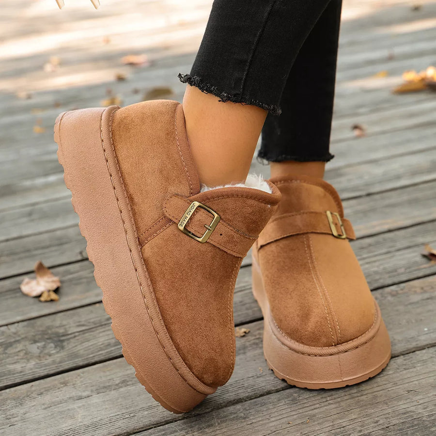 Lady showing a side view of biege Round Toe Platform Boots 