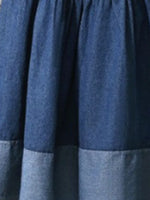 Close-up of a blue denim fabric with a checkered pattern