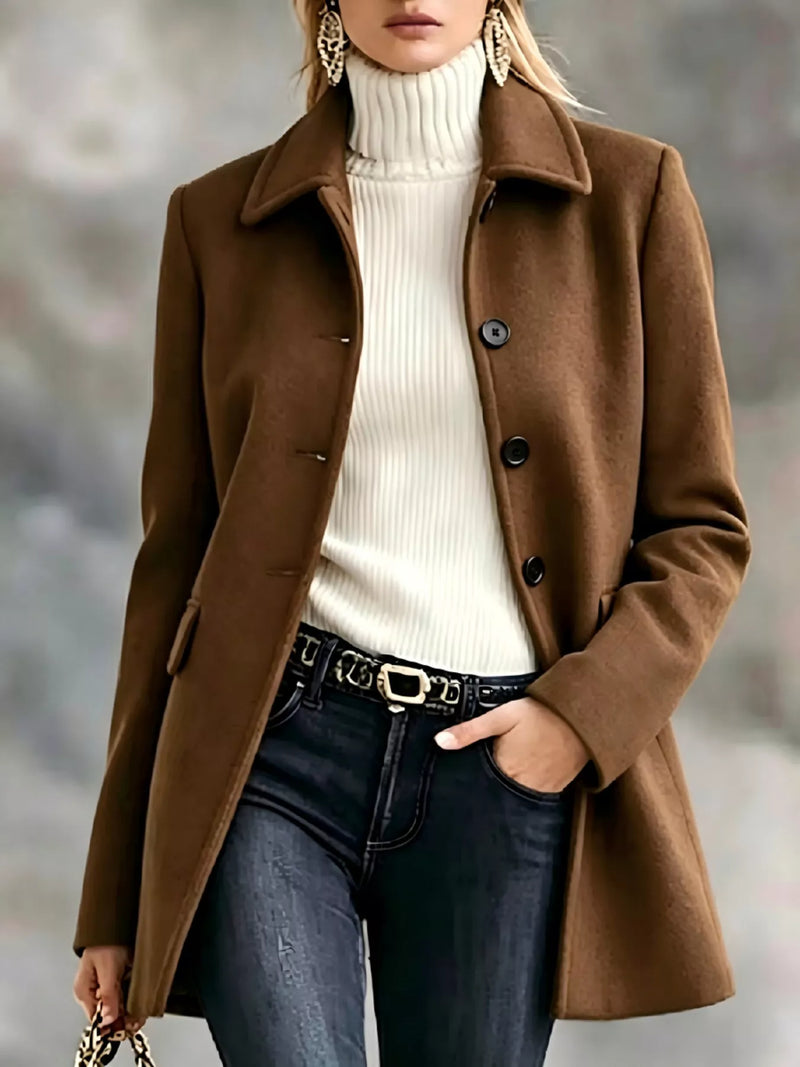 woman wearing Button Up Collared Neck Coat with blue jeans