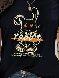 Black t-shirt with a graphic design of a rabbit and text on a person wearing it.