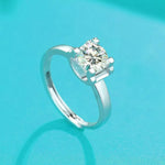 Silver ring with a diamond on a turquoise background