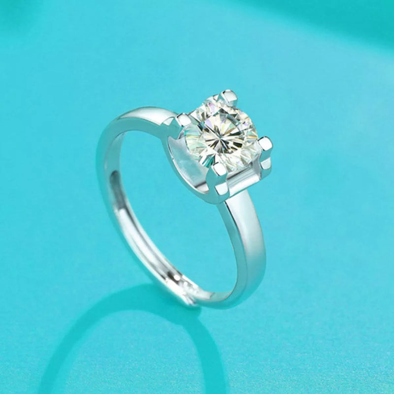 Silver ring with a diamond on a turquoise background
