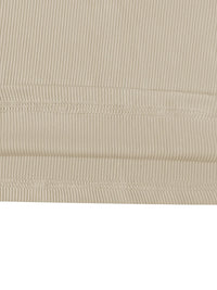 Close-up of beige ribbed fabric with visible stitching on a white background