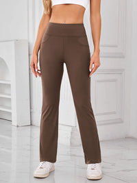 Brown pants worn by a person in a minimalistic indoor setting