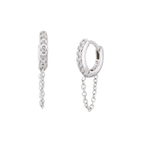 A pair of 14K white gold huggie earrings with chain drops and white diamonds