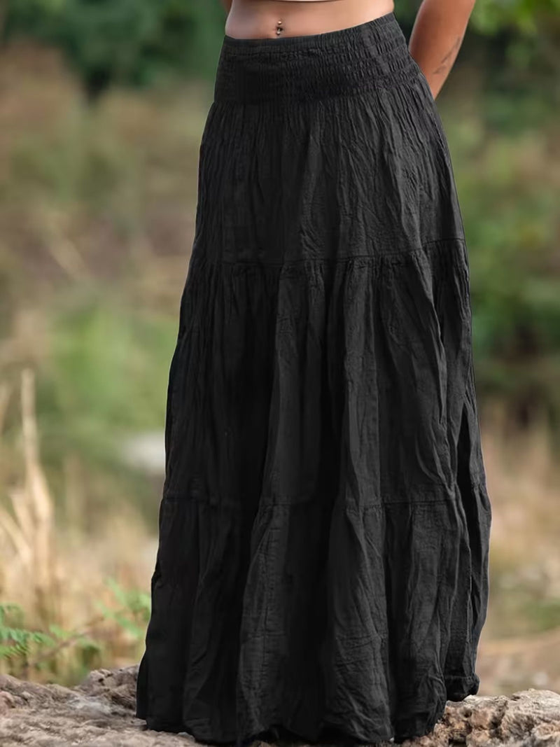 Black layered skirt worn by a person standing outdoors with a blurred natural background