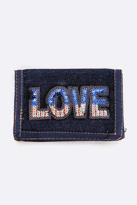 Denim wallet with 'LOVE' embellished in rhinestones on a white background