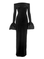 Black long-sleeve gown with ruffled cuffs on a white background