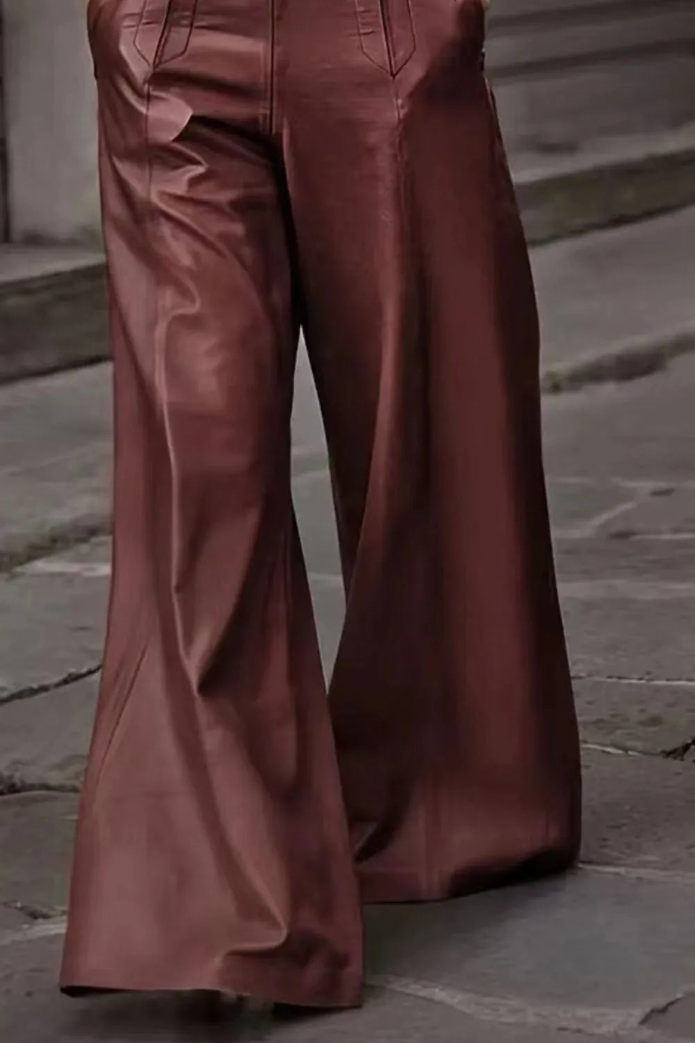 Brown wide-leg pants on a stone pavement background