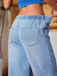 Light blue denim pants worn by a person indoors.