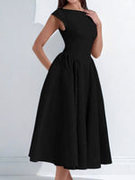 Black dress worn by a person on a white background